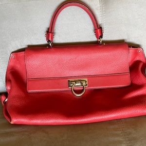 Red Salvatore Ferragamo satchel.